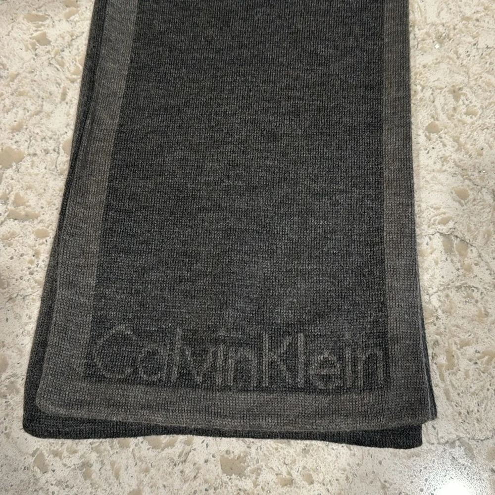 CALVIN KLEIN~CHARCOAL GRAY WITH DARK GRAY BORDER & LOGO AT BOTTOM OF SCARF~UEC
